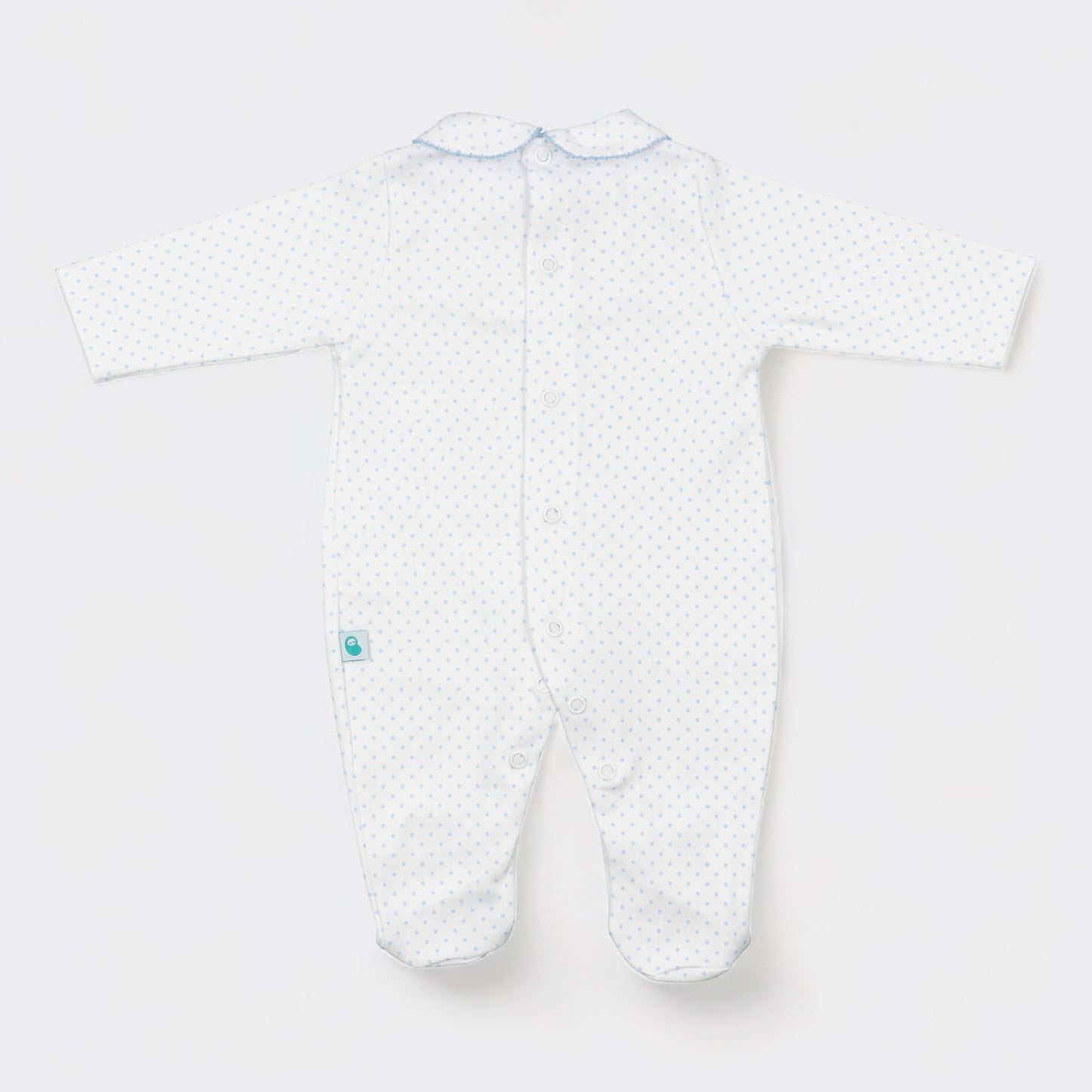 White sleep suit with blue polka dots. Back view