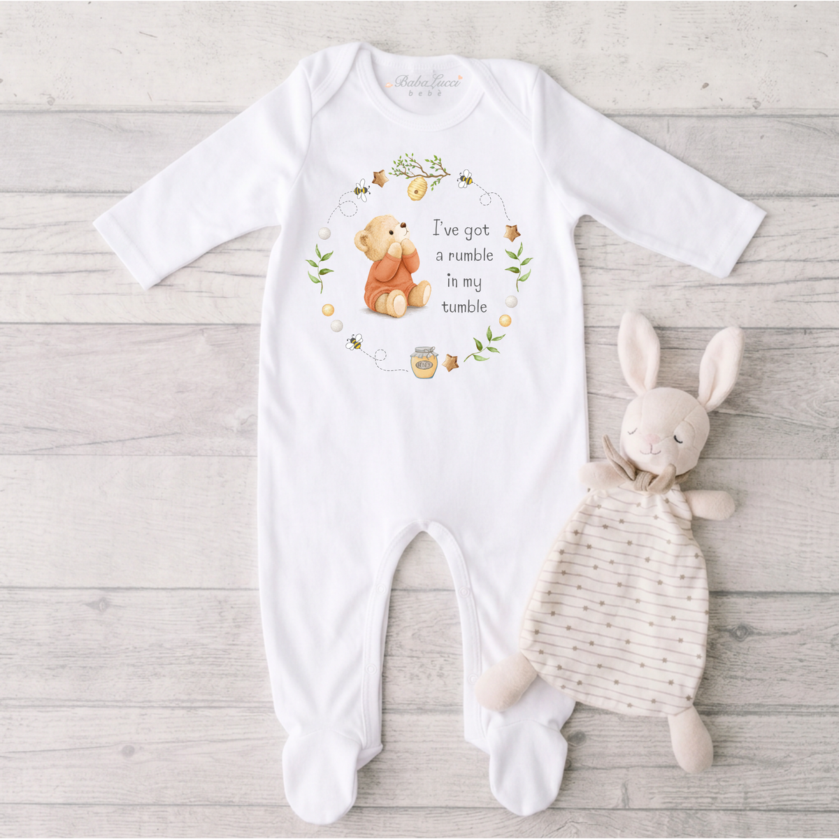 Baby Sleepsuit with Terracotta bear print and the phrase "I've got a rumble in my tumble"