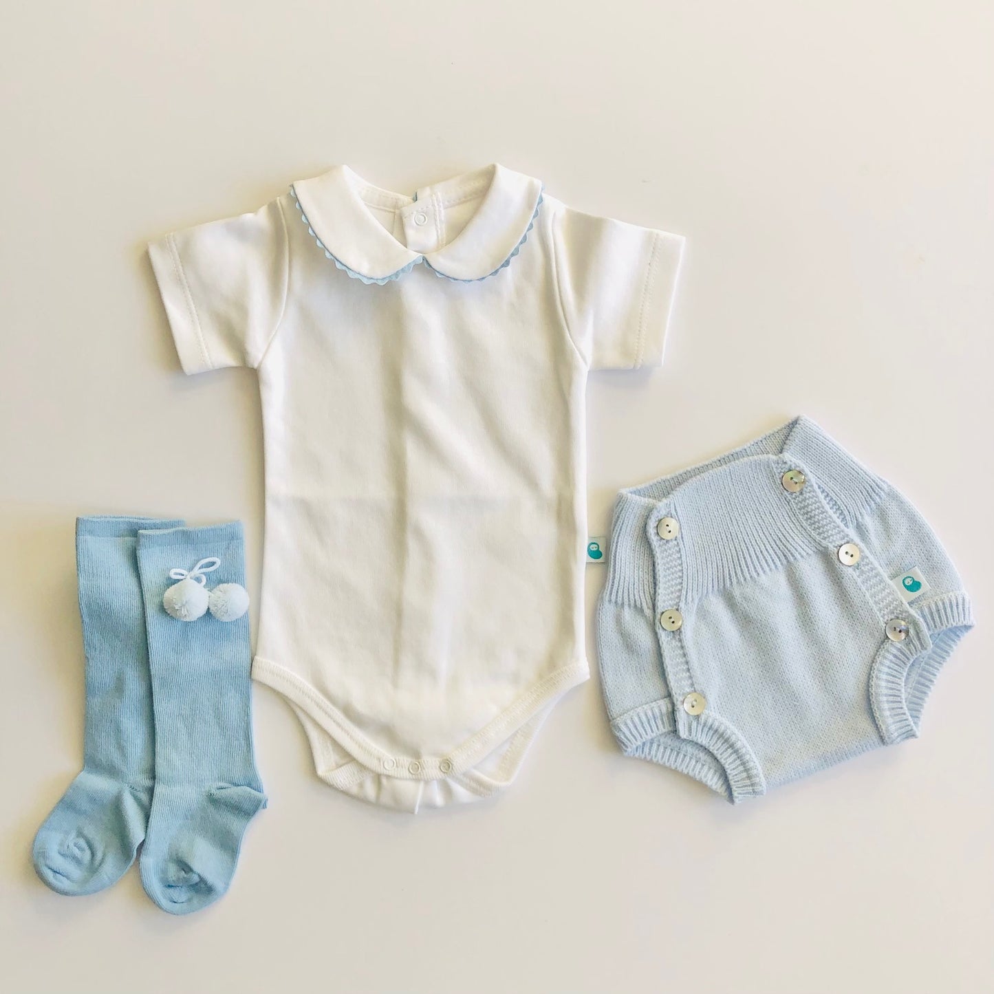 Baby vest shown with co ordinating shorts and socks